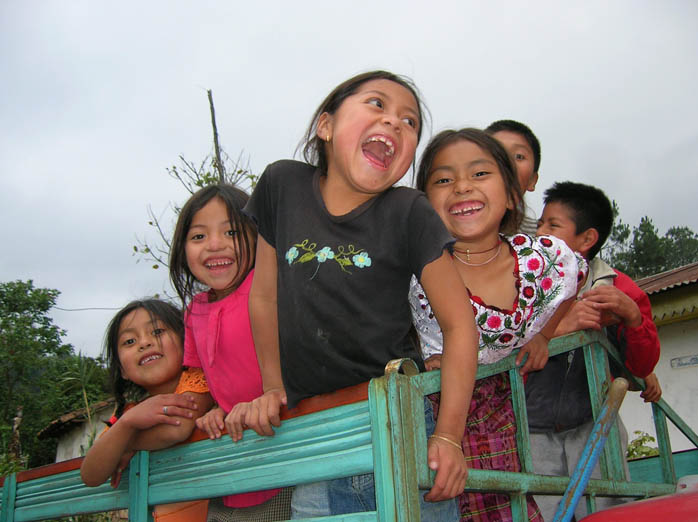 Guatemalan children laughing together. Canadian Friends Service Committee (Quakers) has supported locally-led projects in Canada and around the world to help free people to reach their fullest potential.