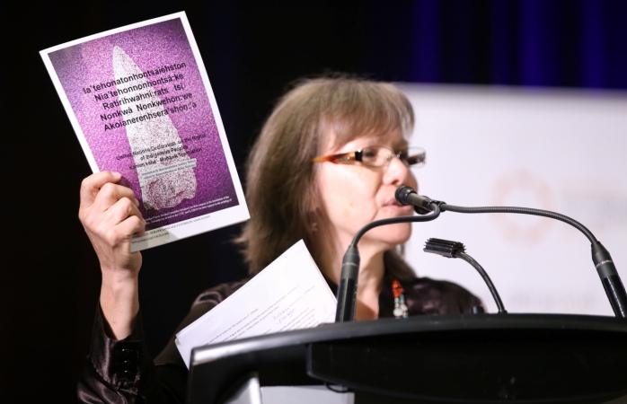 Ellen Gabriel holds a copy of the Kanien'kehá:ka (Mohawk) language version of the UN Declaration on the Rights of Indigenous Peoples at the Truth and Reconciliation Commission of Canada's Closing Events June 1, 2015. CFSC provided financial support for the translation and printing of the Kanien’kehá:ka verison of the UN Declaration. Photo credit: Ben Powless