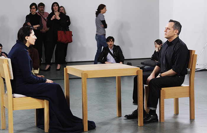Marina Abramović performing The Artist is Present. Shelby Lessig, CC BY-SA 3.0
