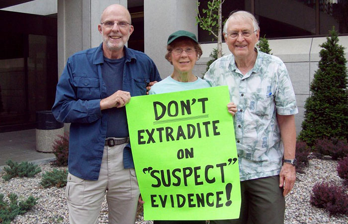 Three Quakers stand with a sign that says "Don't extradite on suspect evidence!" Since 2011 Quakers have called for Hassan Diab not to be extradites to France.