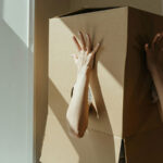 People aren't in fixed boxes, research shows we change all the time. A photo shows a person stands with a box over their head and their arms coming out of holes in it.